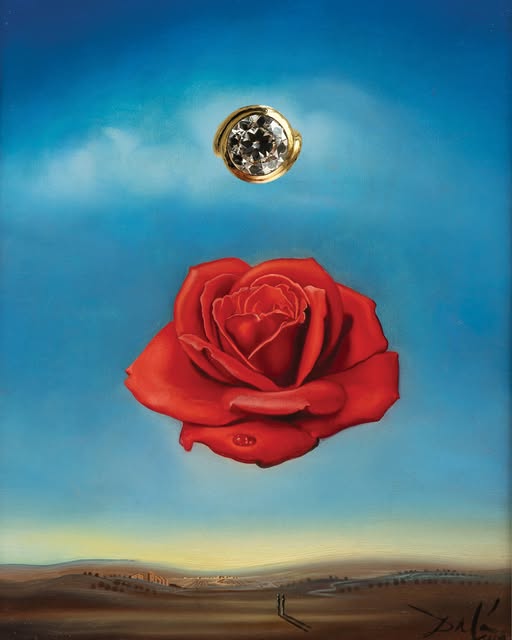 An old cut diamond ring above a painted rose